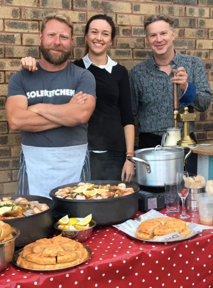 Mark and Mike serving paella 2015